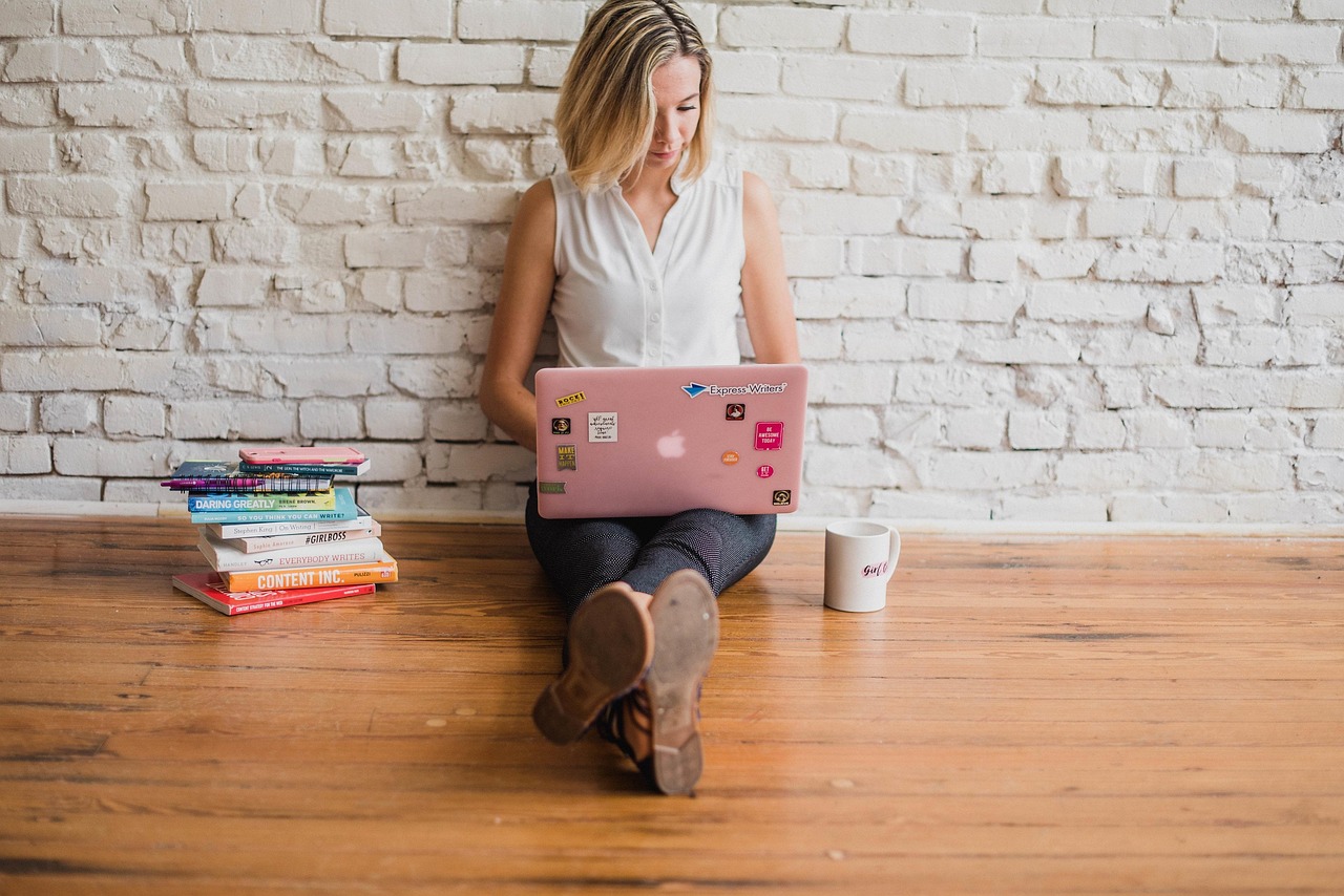 Essay coach working on a laptop